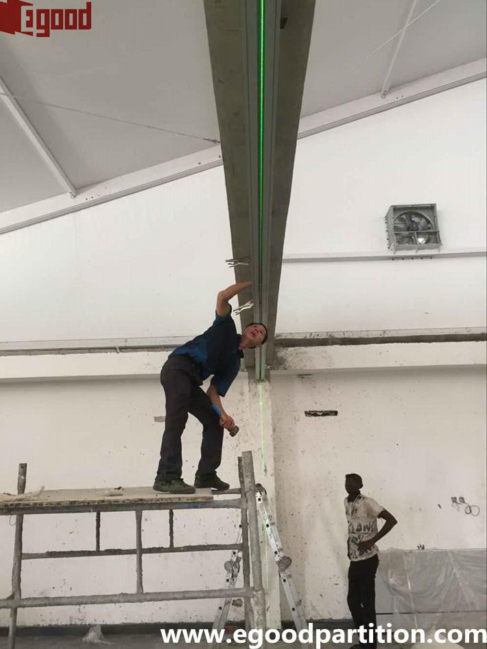 leveling and installing the movable partition track